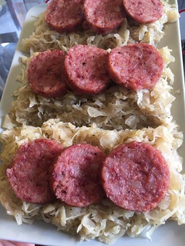 a plate with uncooked meatballs on top of rice at da Lilia in Salute&Bellezza in Monfalcone