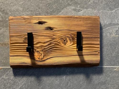 a wooden box sitting on top of the ground at Inovecká Chata in Trenčianske Jastrabie