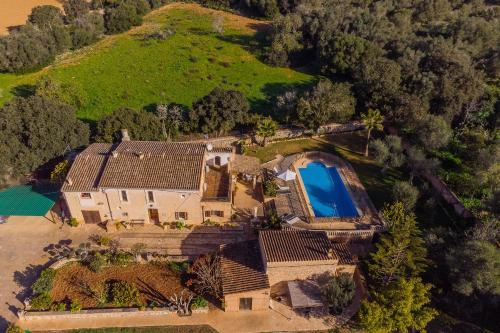 an aerial view of a house with a swimming pool at Finca Cavea in Caʼs Concos