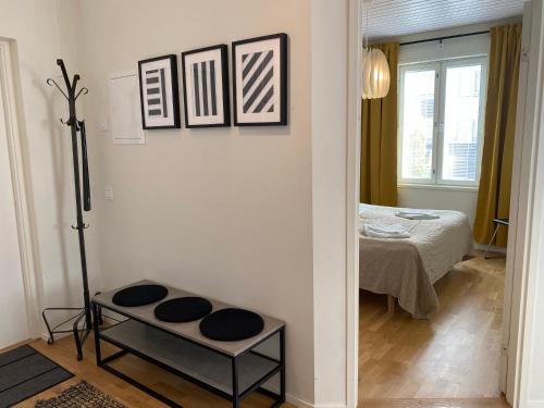 a room with a room with a bed and a mirror at Stava Mosters in Mariehamn