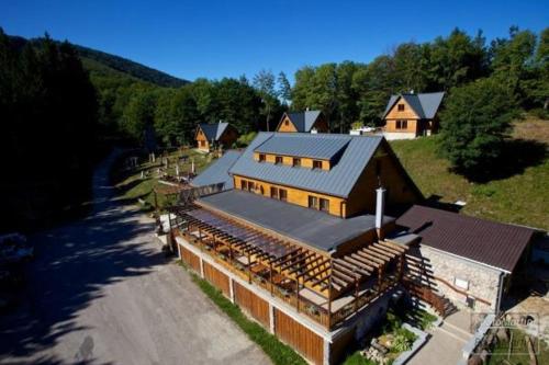 an aerial view of a large house with a road at Inovecká Chata in Trenčianske Jastrabie