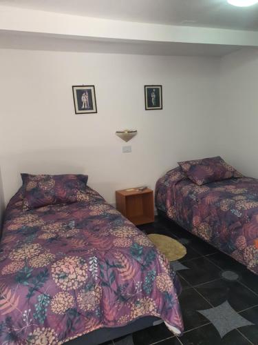 Кровать или кровати в номере ROMA
