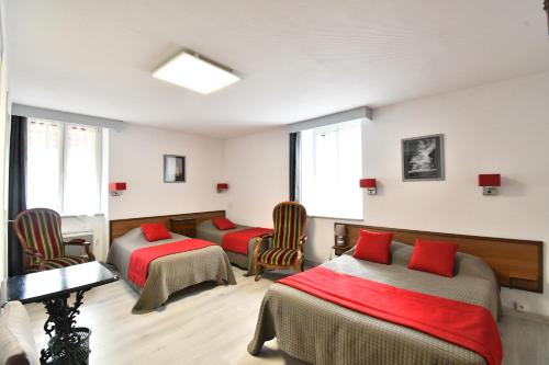 Postel nebo postele na pokoji v ubytování Hotel Fortin