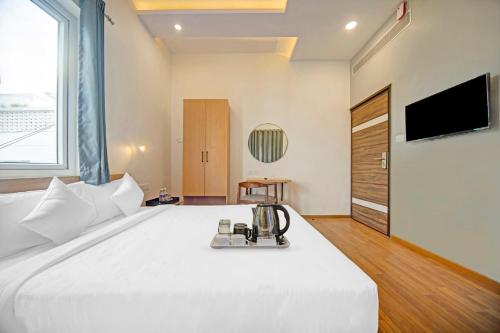 Postel nebo postele na pokoji v ubytování UPAR Hotels - T Nagar