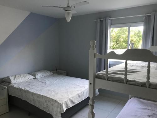 Katil atau katil-katil dalam bilik di Praia Castelhanos - ES