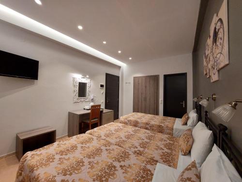 Una cama o camas en una habitación de Hotel Akti