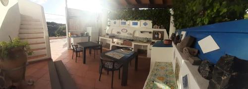 an aerial view of a kitchen with tables and chairs at Bed and Breakfast Villa Angelina in Lipari