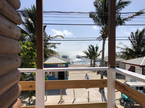 a view from the balcony of a beach house at Blue Wave Guest House in Caye Caulker
