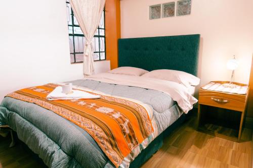 Postel nebo postele na pokoji v ubytování Hostal Mi Peru