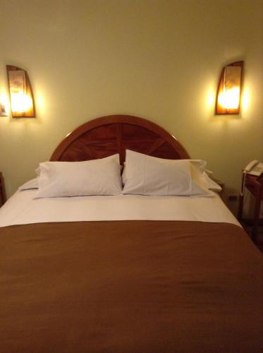 Postel nebo postele na pokoji v ubytování Royal Inn Hotel Juliaca