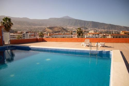 a swimming pool on the roof of a building at Agave Paradise in Puerto de la Cruz
