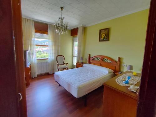 Postel nebo postele na pokoji v ubytování Casa Cabaleiro