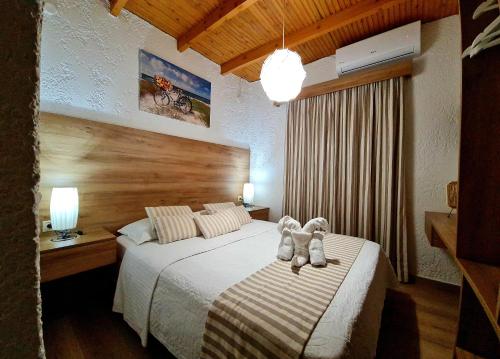Un pat sau paturi într-o cameră la Villa Gala