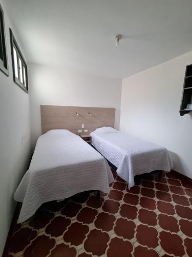 Ein Bett oder Betten in einem Zimmer der Unterkunft Casa Capirucho