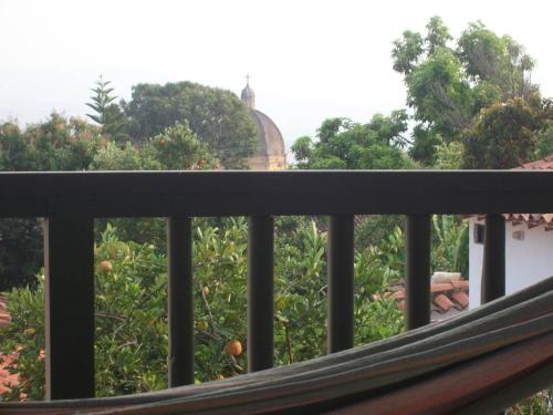a balcony with a view of an apple tree at Hotel Mision Santa Barbara RNT 4799 in Barichara