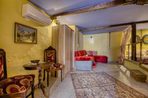 a living room with a couch and a table at Fatma Hanoum boutique hotel in Rhodes Town