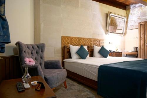 Ένα ή περισσότερα κρεβάτια σε δωμάτιο στο Arte Cave Hotel