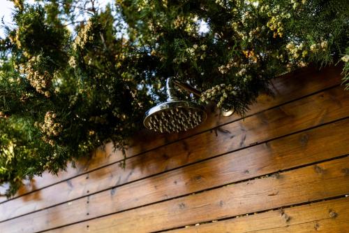 a brush on top of a wooden fence at Casa Villa, Xenia Paliouri in Paliouri