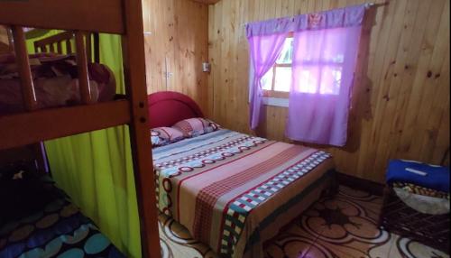 Ein Bett oder Betten in einem Zimmer der Unterkunft Alojamiento El Bosque