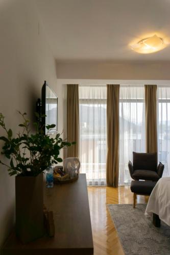 a living room with a couch and a chair and a table at Herceg Vila in Trebinje