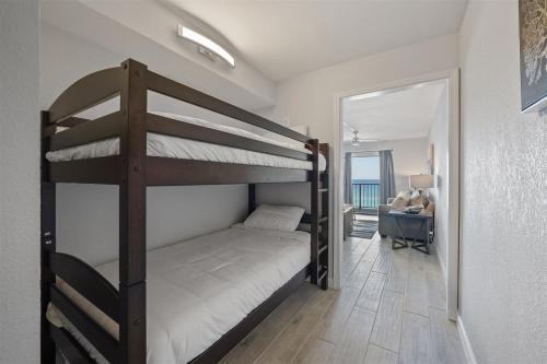 a bedroom with two bunk beds and a desk at The Summit 621 in Panama City Beach