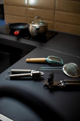 a table with utensils on top of a table at Doral Executive Apartments in David