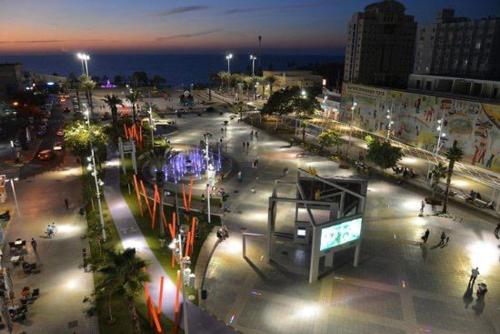 a city at night with a lot of lights at Romy suites Deluxe in Netanya