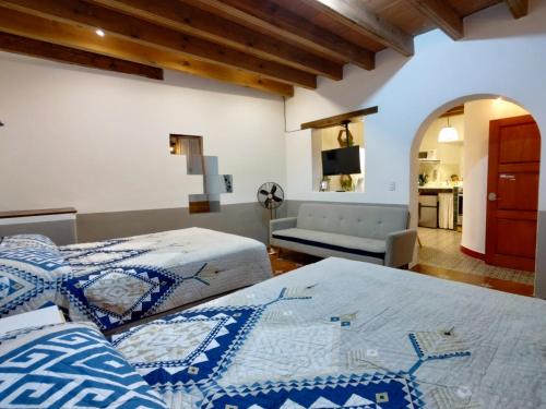 Ein Bett oder Betten in einem Zimmer der Unterkunft Terrazas de la Alameda - Panoramic Aparthotel by Lunian