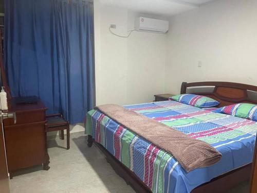 A bed or beds in a room at Casa Vacacional Villanueva