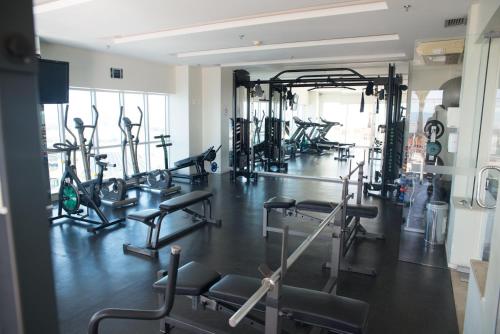a gym with several treadmills and exercise bikes at BSB STAY Premium Flats Particulares - Saint Moritz in Brasilia