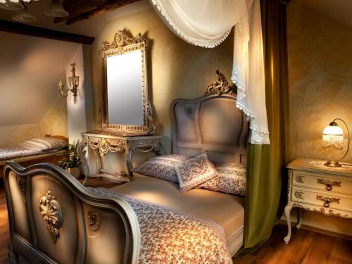a bedroom with two beds and a mirror at Lichtenstein LVA Apartmán in Břeclav