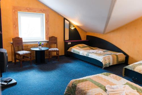Uma cama ou camas num quarto em Hotel Runmis