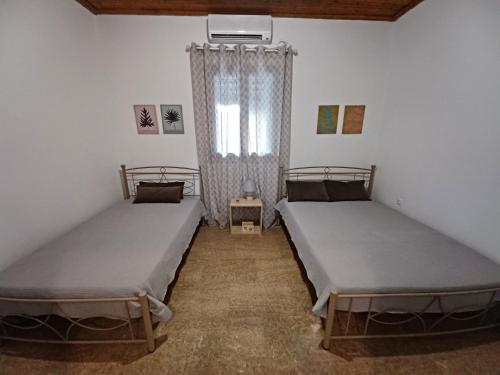 Ένα ή περισσότερα κρεβάτια σε δωμάτιο στο Beach House for up to 9 people near Olympia