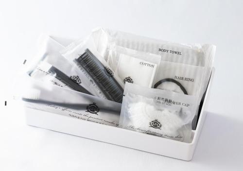 a plastic container filled with different types of mascara at APA Hotel Akihabara Ekikita in Tokyo
