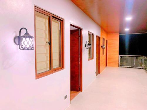 a hallway with a door and a window at House of Aice in El Nido