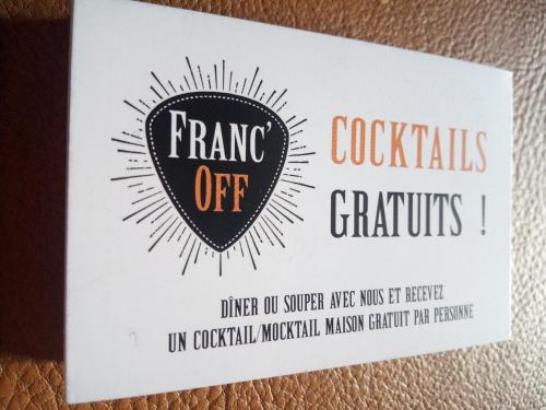 a card with a drawing of a logo on it at L'écurie gîte duplex Welness in Spa