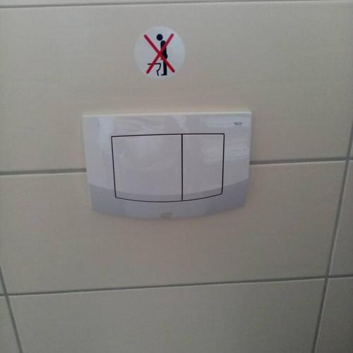a white box on a wall with a sign on it at Familienfreundliche Wohnung Monteurwohnung Netflix in Paderborn