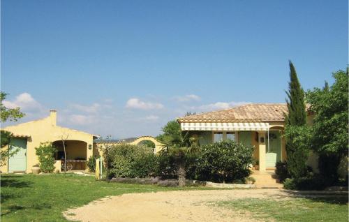 a house with a yard with a driveway at Amazing Home In Cruzy in Cruzy