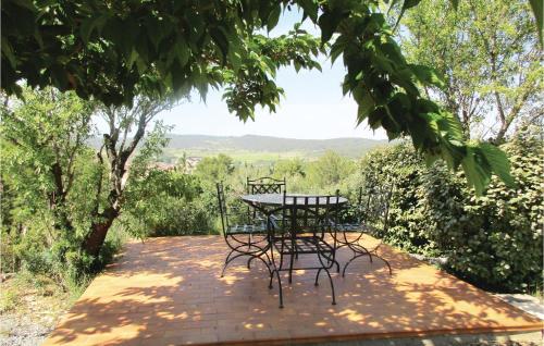 a table and chairs sitting on a brick patio at Amazing Home In Cruzy in Cruzy