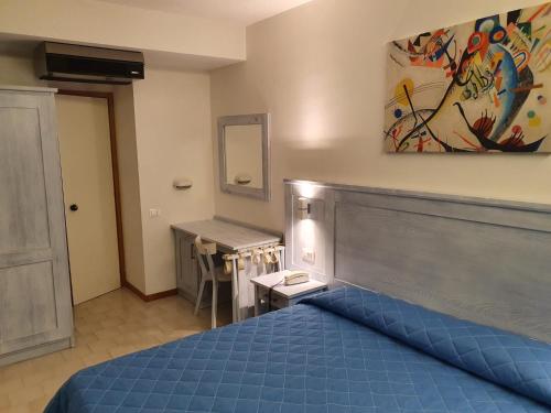 Ένα ή περισσότερα κρεβάτια σε δωμάτιο στο Hotel Le Tre Isole