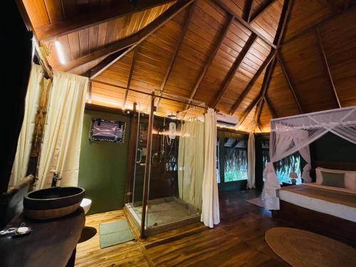 a bathroom with a shower in a room at Yala Lake View Cabanas in Tissamaharama
