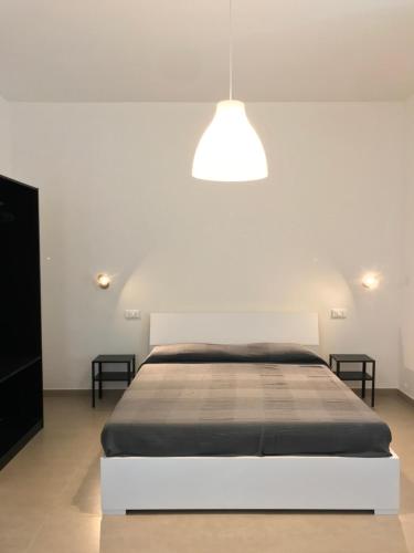Ένα ή περισσότερα κρεβάτια σε δωμάτιο στο Casa via Garibaldi