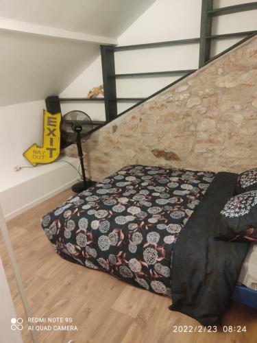 Un pat sau paturi într-o cameră la Petite maison de caractère 4 ou personnes