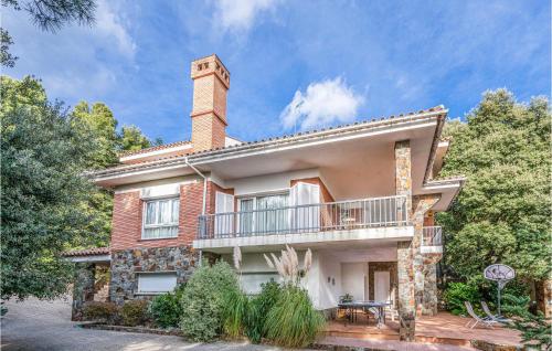 a large brick house with a balcony at 6 Bedroom Gorgeous Home In Matadepera in Matadepera