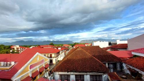 a view of a town with red roofs at Hotel Mercante in Vigan