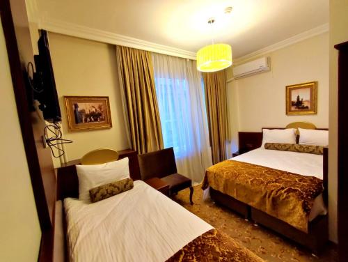 A bed or beds in a room at HOTEL EURO DIAMOND