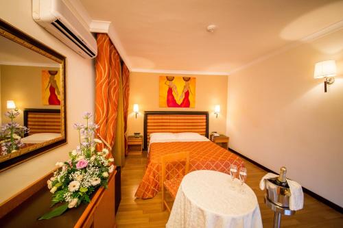 Postel nebo postele na pokoji v ubytování Hotel Ares