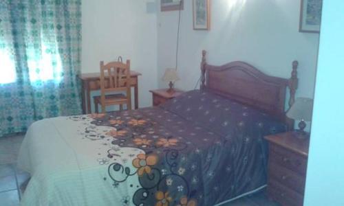Postel nebo postele na pokoji v ubytování Hostal El Arrecife