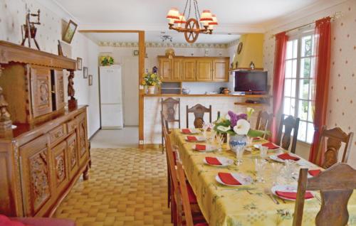 a kitchen with a long table in a room at Holiday Home Penestin Chemin De Camaret in Pénestin