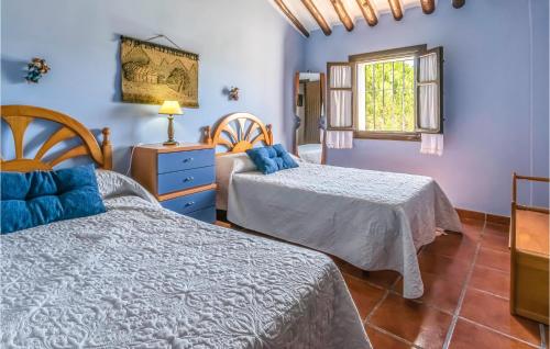 Giường trong phòng chung tại Cortijo Maximino